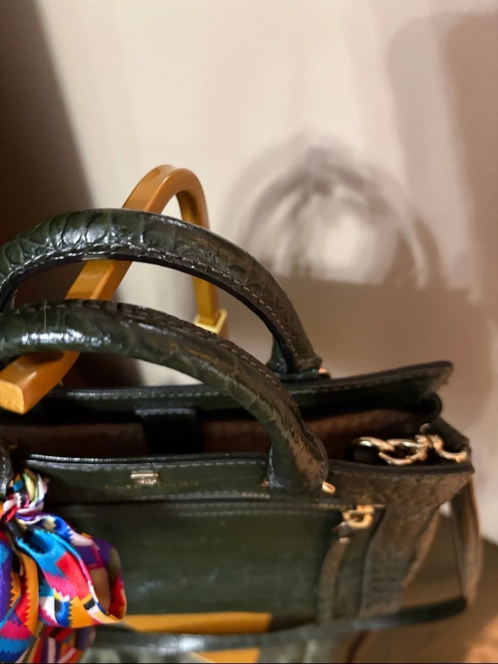 kate spade New York dark green croc-embossed leather satchel with colorful bow